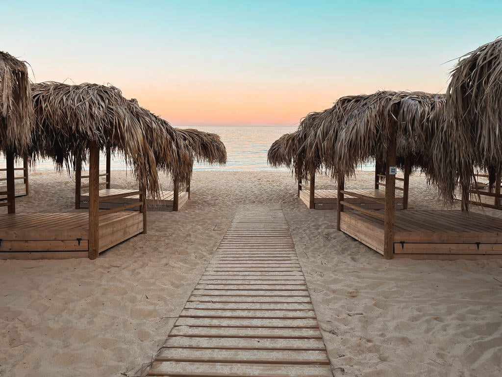 Gazebos in Makronissos Beach at sunset