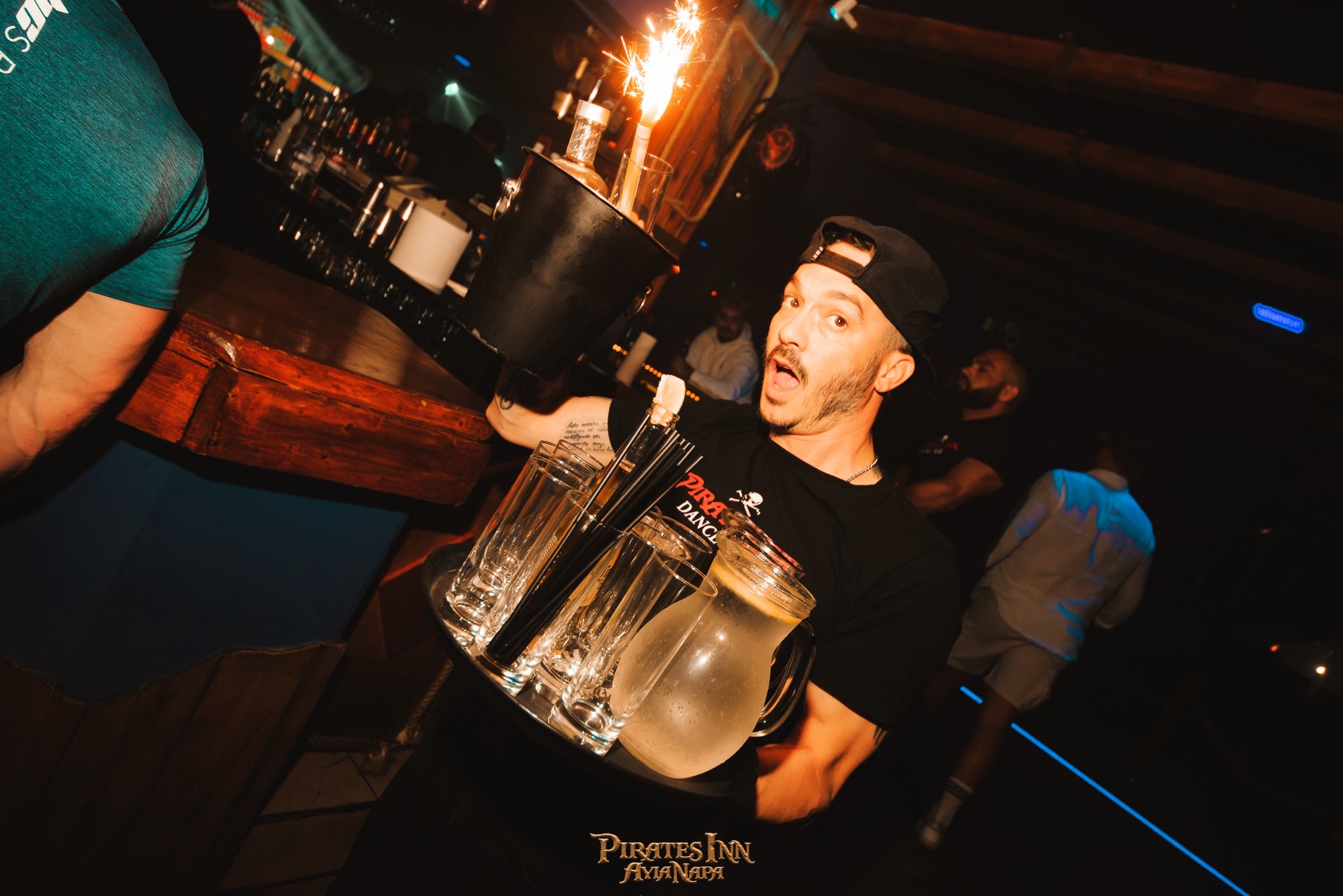 Boy with drinks at pirates bar in Ayia Napa